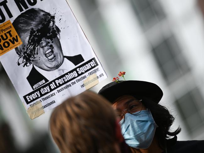 An anti-Trump protester at a Refuse Fascism rally in downtown Los Angeles. The rally called on all votes to be counted in the US election. Picture: AFP