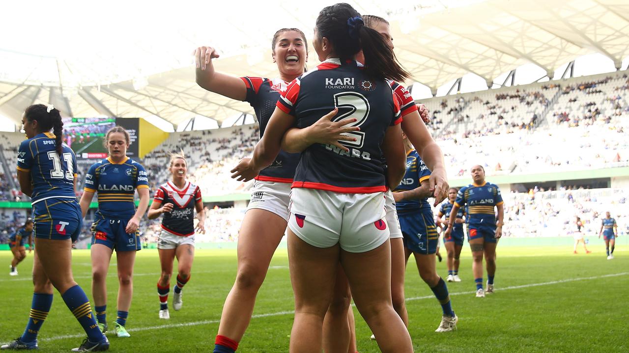 SYDNEY, AUSTRALIA - AUGUST 20: LeianneÃ&#130;Â Tufuga of the Roosters celebrates with team mates after scoring a try during the round one NRLW match between the Parramatta Eels and the Sydney Roosters at CommBank Stadium on August 20, 2022, in Sydney, Australia. (Photo by Matt Blyth/Getty Images)