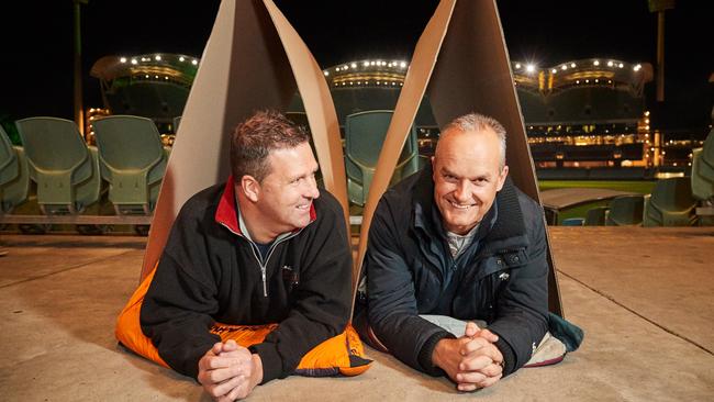 SkyCity Adelaide Casino general manager Luke Walker and BankSA CEO Nick Reade get comfy at Adelaide Oval for the Vinnies CEO sleepout. Picture: AAP / Matt Loxton