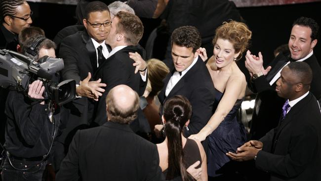 The cast of Crash, including actors Sandra Bullock, Matt Dillon and Terence Howard celebrate after the film won Best Picture.