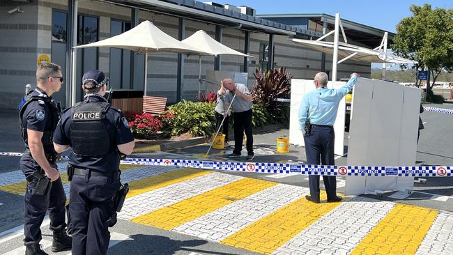 Staff seen cleaning up the scene after Mr Whenuaroa’s stabbing. Picture: Keith Woods.