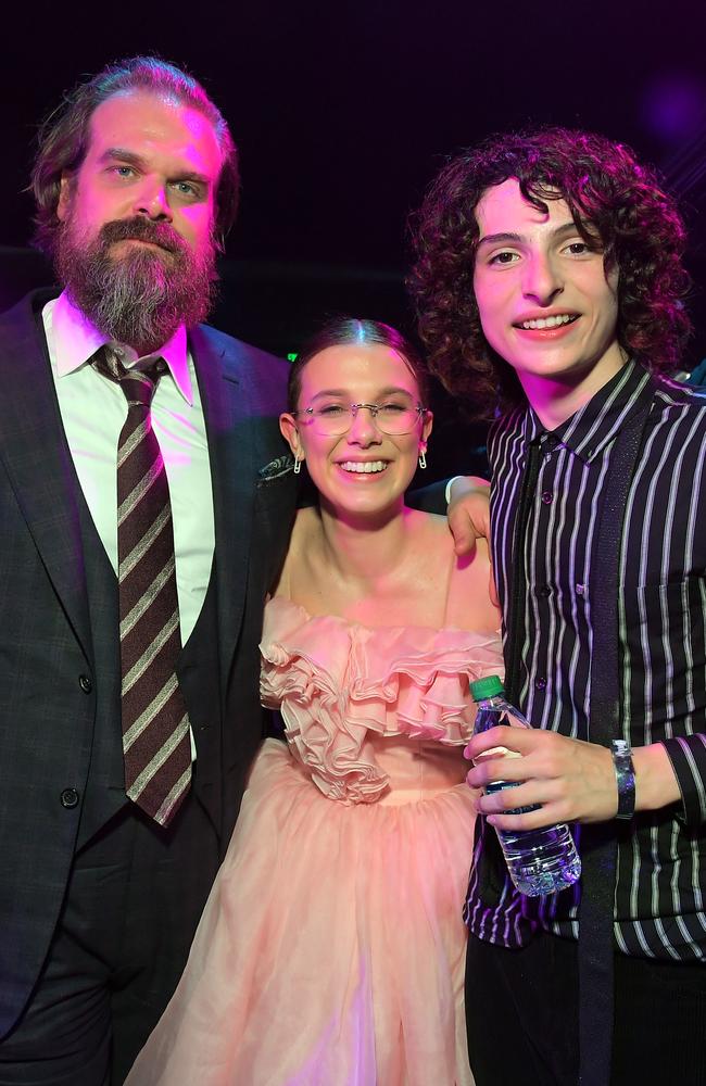 David Harbour, Millie Bobby Brown and Finn Wolfhard at the Stranger Things Season 3 premiere in 2019. Picture: Charley Gallay/Getty Images for Netflix.