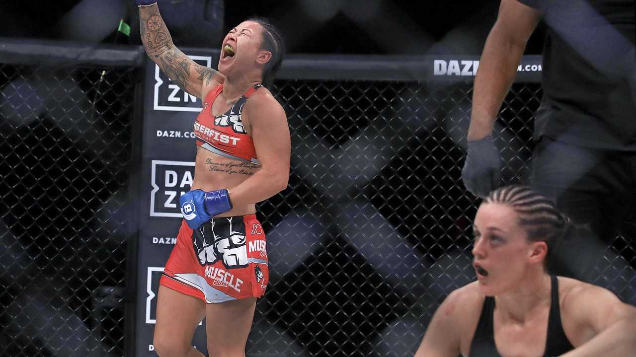 Arlene Blencowe, left, celebrates after beating Amber Leibrock, bottom right, during a featherweight mixed martial arts bout at Bellator 206 in San Jose, Calif., Saturday, Sept. 29, 2018. Blencowe won by knockout in the third round. (AP Photo/Jeff Chiu). Picture: Jeff Chiu