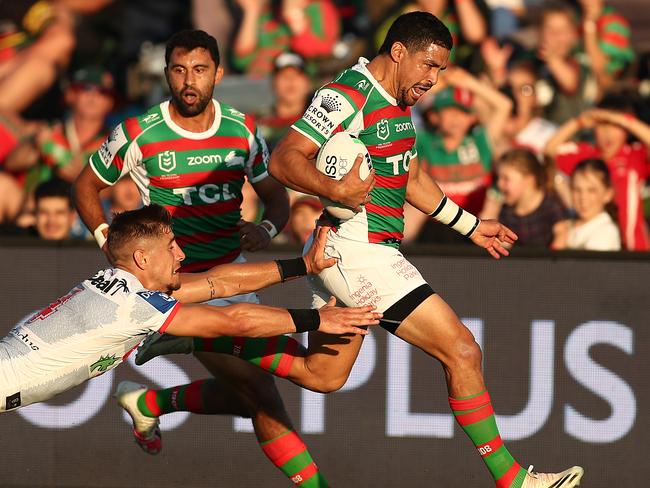 MUDGEE, AUSTRALIA - FEBRUARY 27: Cody Walker of the Rabbitohs evades the tackle of Zac Lomax of the Dragons to score a try during the Charity Shield & NRL Trial Match between the South Sydney Rabbitohs and the St George Illawarra Dragons at Glen Willow Regional Sports Stadium on February 27, 2021 in Mudgee, Australia. (Photo by Mark Metcalfe/Getty Images)