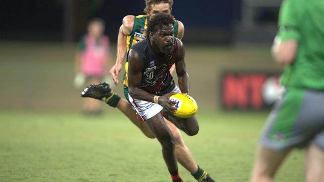 Brendan Kantilla on the run for Tiwi in Round 2 of the 2024-25 NTFL season. Picture: Pema Tamang Pakhrin