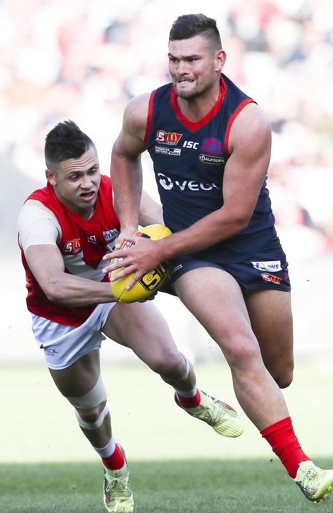 Norwood’s Mitch Grigg evades North Adelaide’s Robbie Young in the SANFL grand final. Picture: Sarah Reed