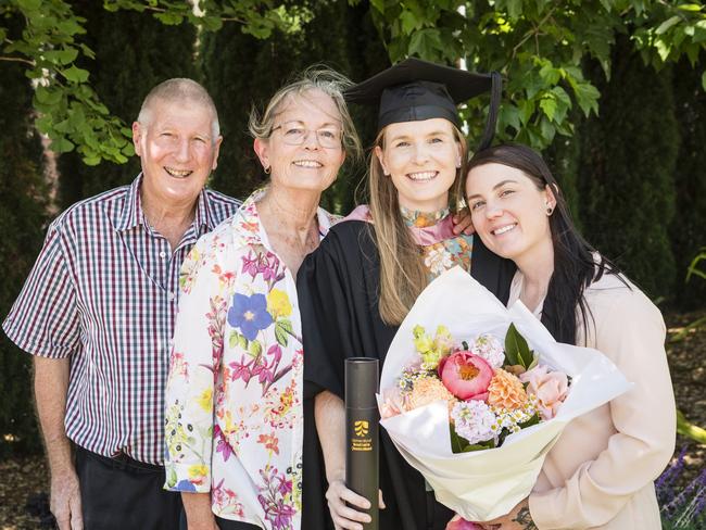 Master of Education (Distinction) graduate Francesca Hayes with family (from left) Trevor, Evelyn and Phoebe Hayes at a UniSQ graduation ceremony at Empire Theatres, Tuesday, October 31, 2023. Picture: Kevin Farmer