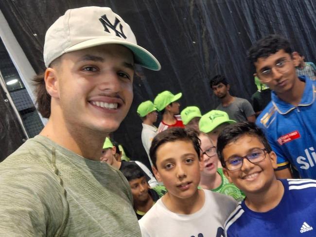 Konstas with budding young cricketer Shahzad Muhammad Khan (white shirt) not long after his dad crashed the car.