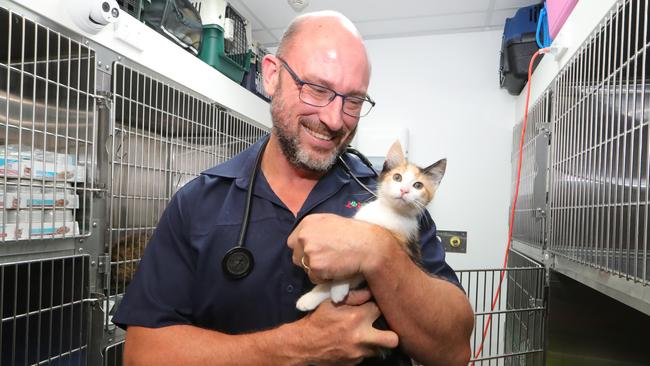 Dr Rob Webster with one of the house cats. Picture Glenn Hampson