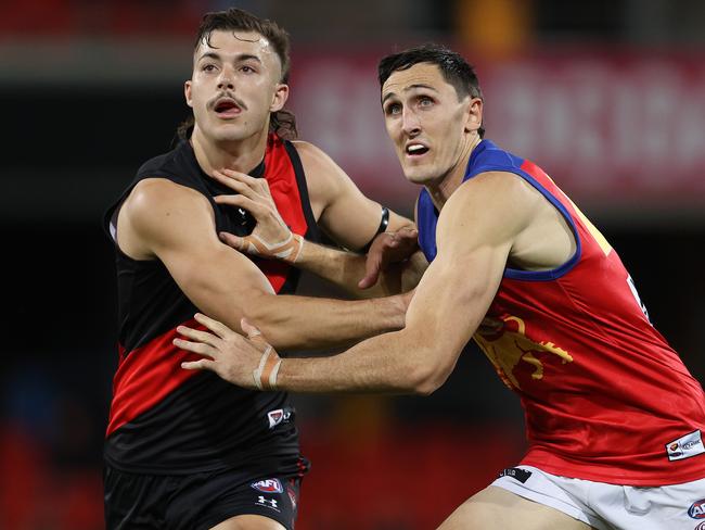 AFL Round 9. Essendon vs Brisbane at Metricon Stadium, Gold Coast.  31/07/2020.    Sam Draper of the Bombers battles with Oscar McInerney of the Lions q1   . Pic: Michael Klein