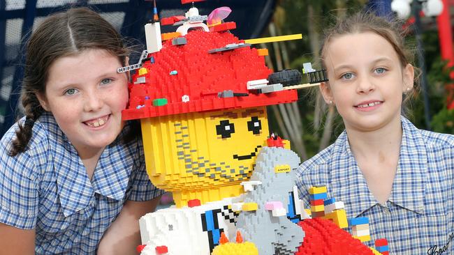 Katana Craig and Felicity Channells at Dreamworld yesterrsay with a Lego man. Photo: Richard Gosling