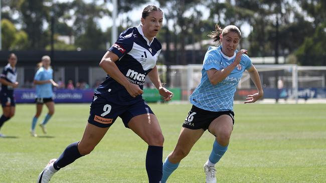 MELBOURNE, AUSTRALIA – MARCH 17: Emily Gielnik of the Victory is chased by Karly Roestbakken of Melbourne City during the A-League Women round 20 match between Melbourne Victory and Melbourne City at La Trobe University Sports Fields, on March 17, 2024, in Melbourne, Australia. (Photo by Robert Cianflone/Getty Images)