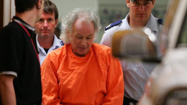 Ivan Milat dressed in his orange overalls is handcuffed. Picture: Gary Ramage