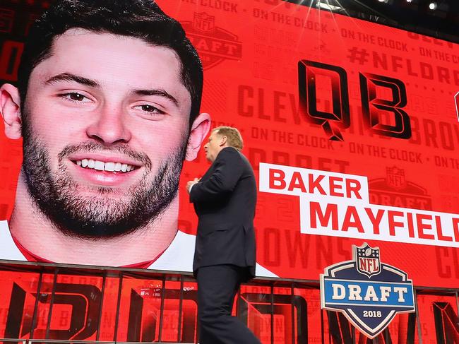 ARLINGTON, TX - APRIL 26: NFL Commissioner Roger Goodell walks past a video board displaying an image of Baker Mayfield of Oklahoma after he was picked #1 overall by the Cleveland Browns during the first round of the 2018 NFL Draft at AT&T Stadium on April 26, 2018 in Arlington, Texas.   Ronald Martinez/Getty Images/AFP == FOR NEWSPAPERS, INTERNET, TELCOS & TELEVISION USE ONLY ==