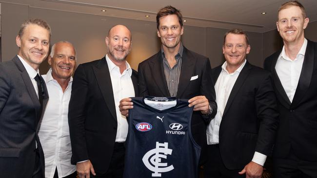 Tom Brady is presented with a Carlton jumper. Pic: @the.cwolf Joshua Scott