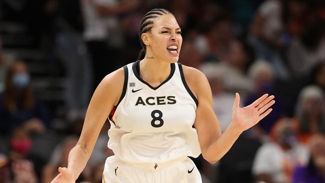 PHOENIX, ARIZONA - OCTOBER 06: Liz Cambage #8 of the Las Vegas Aces celebrates after a three-point shot against the Phoenix Mercury during the second half in Game Four of the 2021 WNBA semifinals at Footprint Center on October 06, 2021 in Phoenix, Arizona. The Aces defeated the Mercury 93-76.  NOTE TO USER: User expressly acknowledges and agrees that, by downloading and or using this photograph, User is consenting to the terms and conditions of the Getty Images License Agreement. (Photo by Christian Petersen/Getty Images)