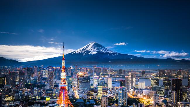 Mt Fuji and Tokyo skyline at dusk.