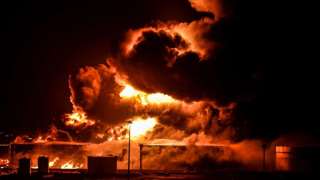 Smoke and flames rise from a Saudi Aramco oil facility in Saudi Arabia's Red Sea coastal city of Jeddah, on March 25, 2022, following a reported Yemeni rebels attack