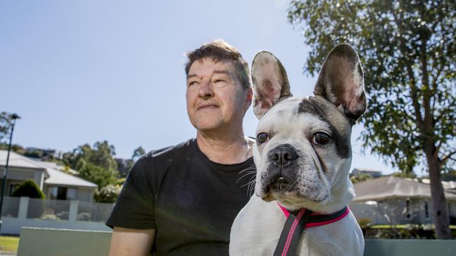 Alan Williams was ambushed in the middle of a street at Ormeau by three men who got out of a car and tried to steal his french bulldog, Chilli, late last year. Picture: Jerad Williams