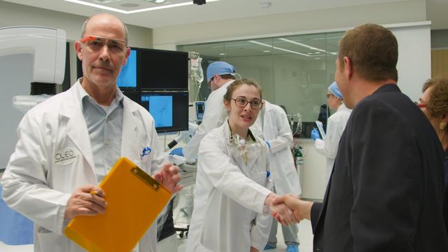 Johnny Boston greets scientists at a Cryonics facility in the film 2030.