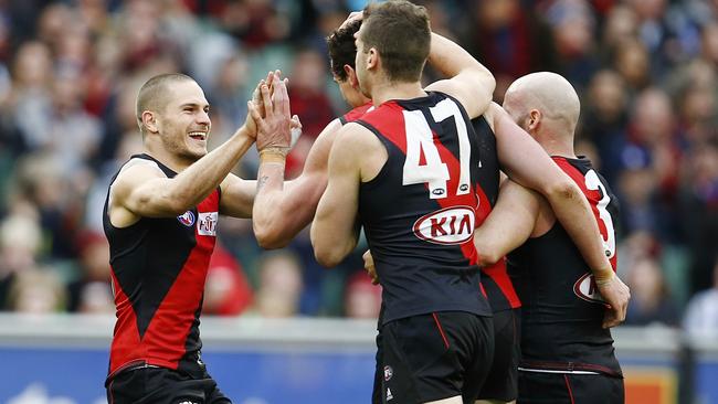 Bomber David Zaharakis celebrates a goal with teammates. Picture: Michael Klein