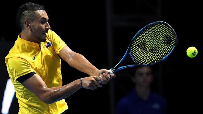 Nick Kyrgios plays a shot against Rafael Nadal during the Sydney Fast4 exhibition. A knee injury has since ruled him out of the World Tennis Challenge. Picture: Dan Himbrechts (AAP)