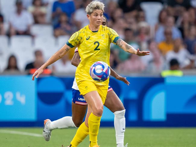 MARSEILLE, FRANCE - JULY 31: Michelle Heyman #2 of Australia is defended by Naomi Girma #4 of the United States  during the Women's Group B match between Australia and USWNT during the Olympic Game Paris 2024 at Stade de Marseille on July 31, 2024 in Marseille, France. (Photo by Brad Smith/ISI/Getty Images).