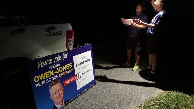 Campaign workers for Councillor William Owen-Jones preparing in darkness before polling booths opened in the council election.