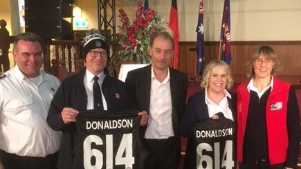 Maj Brendan Nottle (left) with new Salvos national leader Commissioner Robert Donaldson, David Emerson from Collingwood Football Club, Commissioner Janine Donaldson and Maj Sandra Nottle.