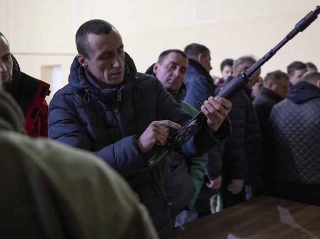 Members of the public are given weapons training at the Solonka administration building in Lviv, Ukraine. Picture: Getty Images