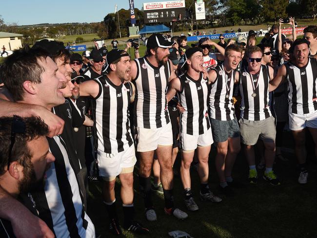 Reynella players celebrate Saturday’s SFL premiership victory. Picture: Roger Wyman.