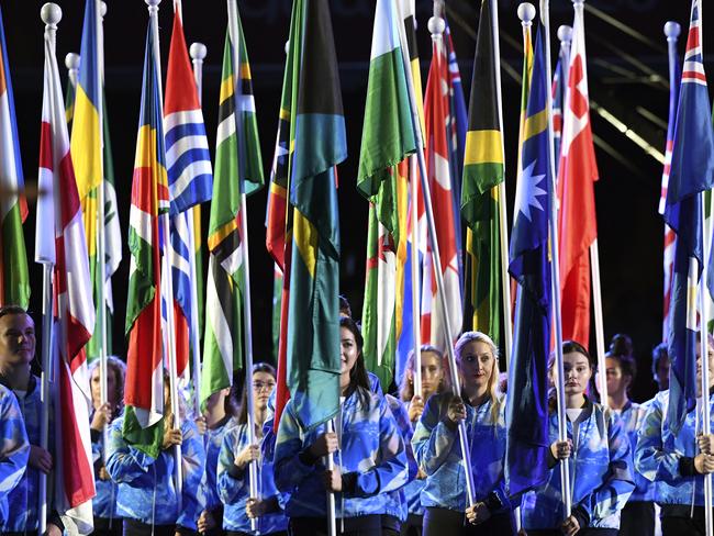 Flag bearers are seen during the Opening Ceremony of the XXI Commonwealth Games at Carrara Stadium, on the Gold Coast, Wednesday, April 4, 2018. (AAP Image/Dean Lewins) NO ARCHIVING, EDITORIAL USE ONLY