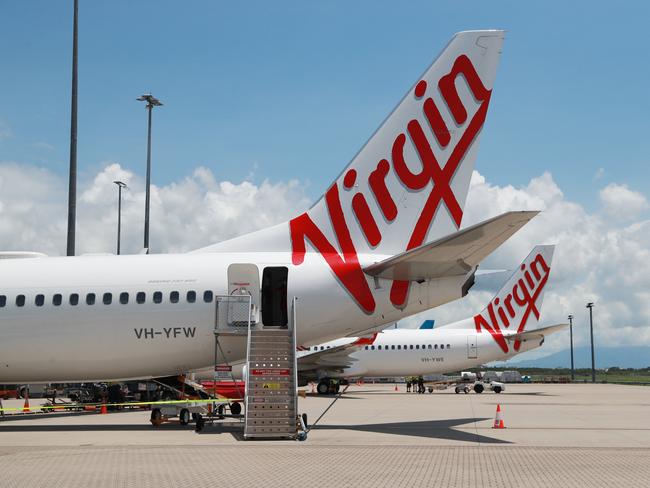 A Virgin Australia Boeing 737 passenger jet aircraft on the tarmac apron at Cairns Airport. Picture: Brendan Radke