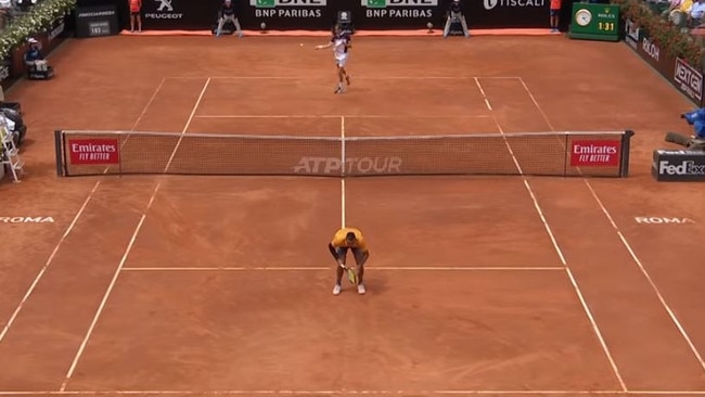 Nick Kyrgios gives up on the point and shows his backside to Daniil Medvedev.