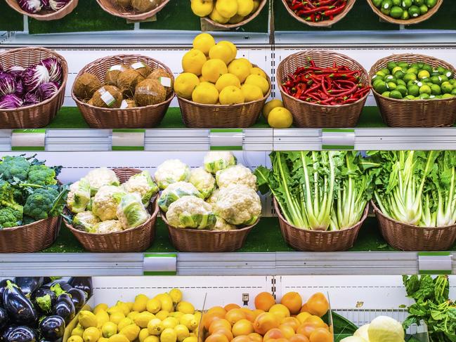 Fruits and vegetables on a supermarket shelf.