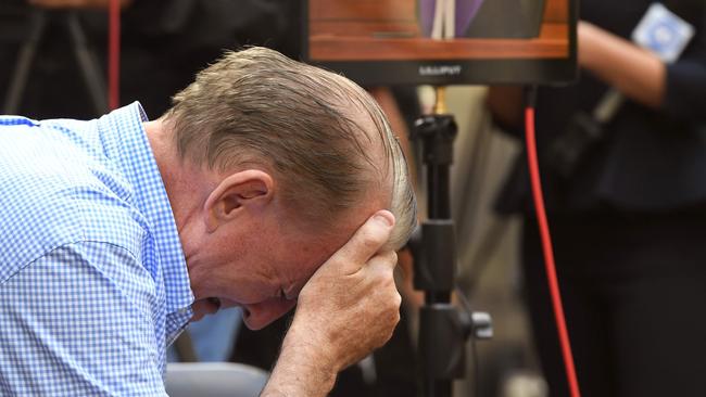 A man reacts as he listens to County Court Chief Judge Peter Kidd speak during the sentencing. Picture: William West/AFP