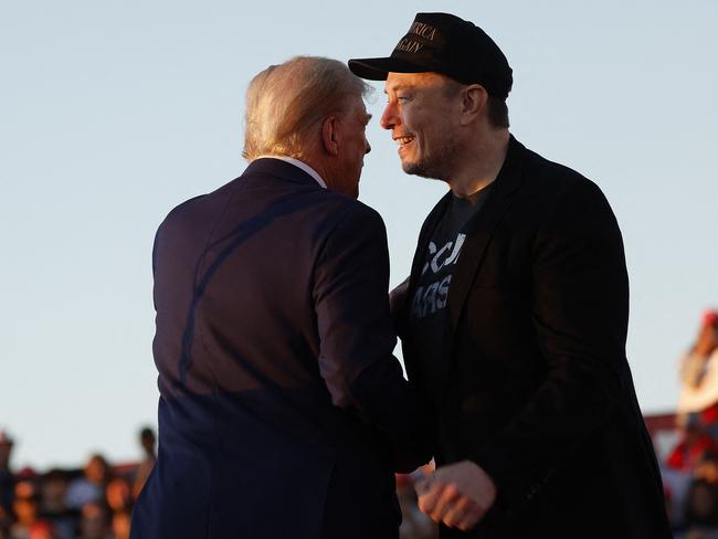 Elon Musk embraces Republican presidential nominee Donald Trump during the Butler rally. Picture: Getty Images via AFP