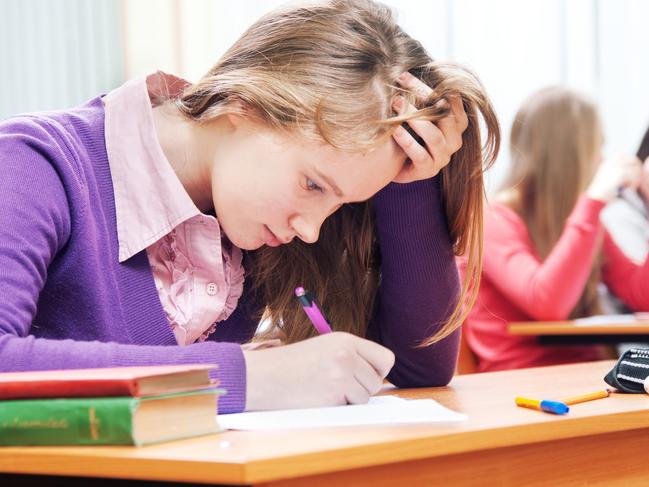 CAREERS: Student sitting at the classroom and working hard