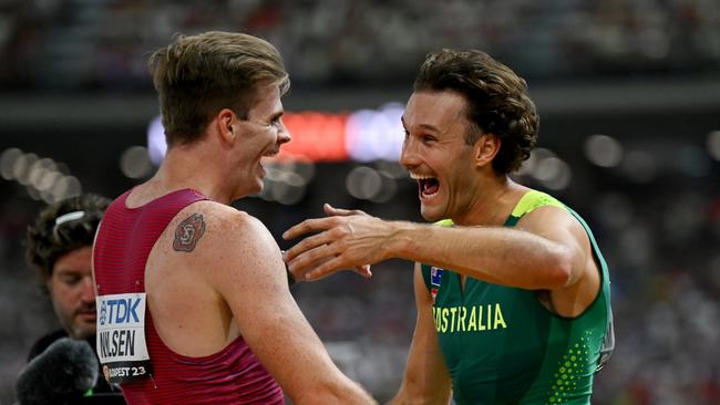 BUDAPEST, HUNGARY - AUGUST 26: Kurtis Marschall of Team Australia reacts with Christopher Nilsen of Team United States after the Men's Pole Vault Final during day eight of the World Athletics Championships Budapest 2023 at National Athletics Centre on August 26, 2023 in Budapest, Hungary. (Photo by Hannah Peters/Getty Images)
