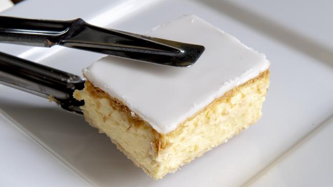 A traditional vanilla slice from Gusto Bakery in Strathmore, which was awarded the highest score in Australia by an Essendon vanilla slice reviewer. Picture: Andy Brownbill