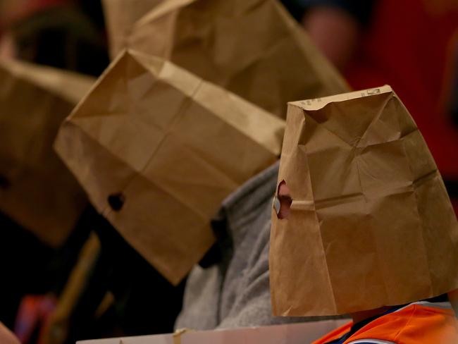 NEW YORK, NY - JANUARY 08: New York Knicks fans wear bags over their heads and react as the New York Knicks lose at Madison Square Garden on January 8, 2015 in New York City.The Houston Rockets defeated the New York Knicks 120-96. NOTE TO USER: User expressly acknowledges and agrees that, by downloading and/or using this photograph, user is consenting to the terms and conditions of the Getty Images License Agreement. Elsa/Getty Images/AFP == FOR NEWSPAPERS, INTERNET, TELCOS & TELEVISION USE ONLY ==