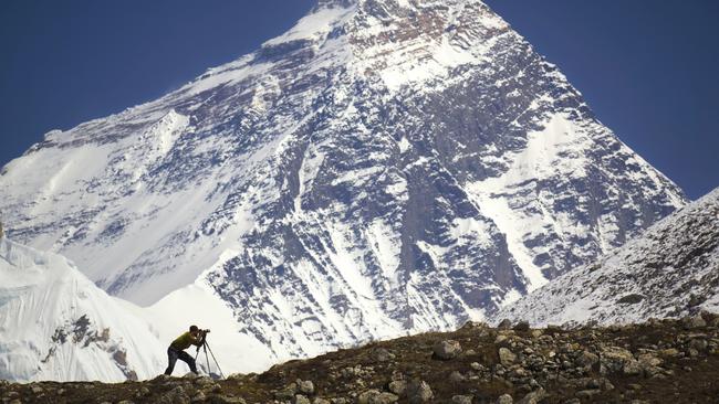 ESCAPE: WHEN TO BOOK NEPAL .. Mercedes Maguire story .. A man is standing in front of Mt. Everest. Nepal, Everest region (Sagarmatha National Park), Everest (8,850 m). Picture: iStock