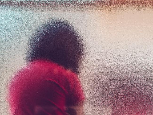 Silhouette of unrecognizable sad child. Generic iStock image.