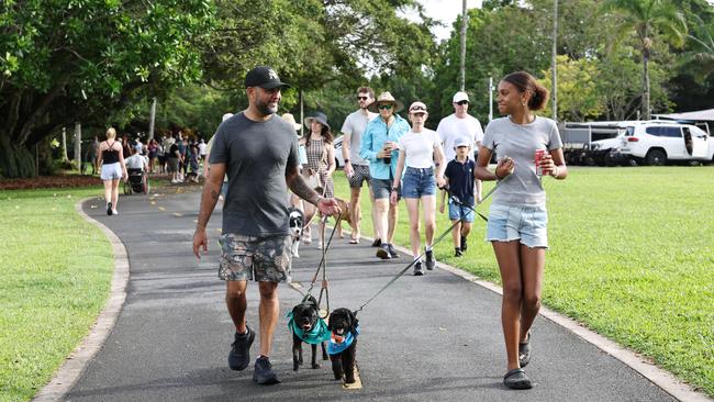 Erwin Lutz walks Django and Peyton Mason walks Morris in the RSPCA's Million Paws Walk fundraising event along the Cairns Esplanade. Picture: Brendan Radke