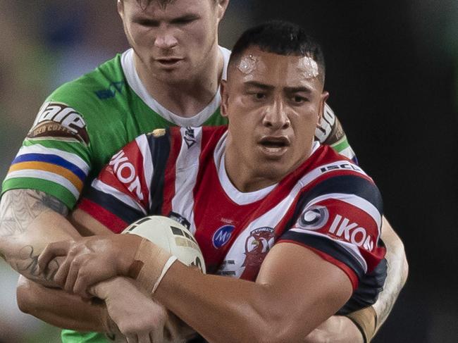 Siosiua Taukeiaho of the Roosters is tackled during the 2019 NRL Grand Final between the Canberra Raiders and the Sydney Roosters at ANZ Stadium in Sydney, Sunday, October 6, 2019. (AAP Image/Craig Golding) NO ARCHIVING, EDITORIAL USE ONLY