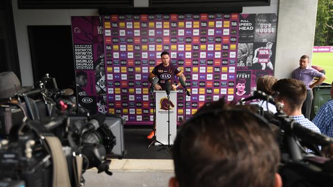 The media keeps a safe distance from Brisbane Broncos player Darius Boyd. (AAP Image/Dan Peled)