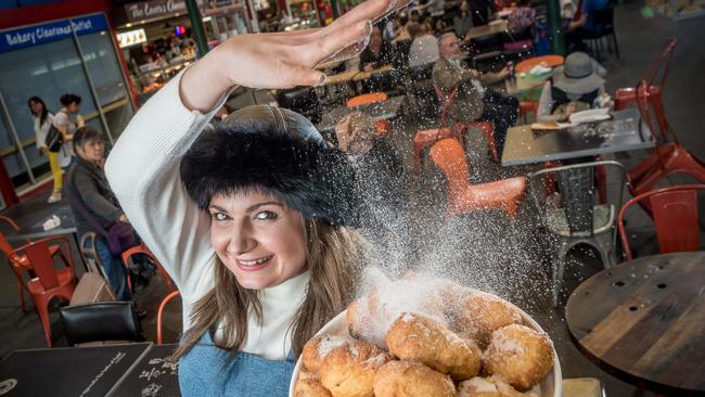 Jess Pelich at Preston Market sells the only Russian donuts of their kind in Melbourne. When taking photos for #SnapMelbourne think about images that tell a story or show a slice of life, Canon experts suggest. Picture: Jake Nowakowski