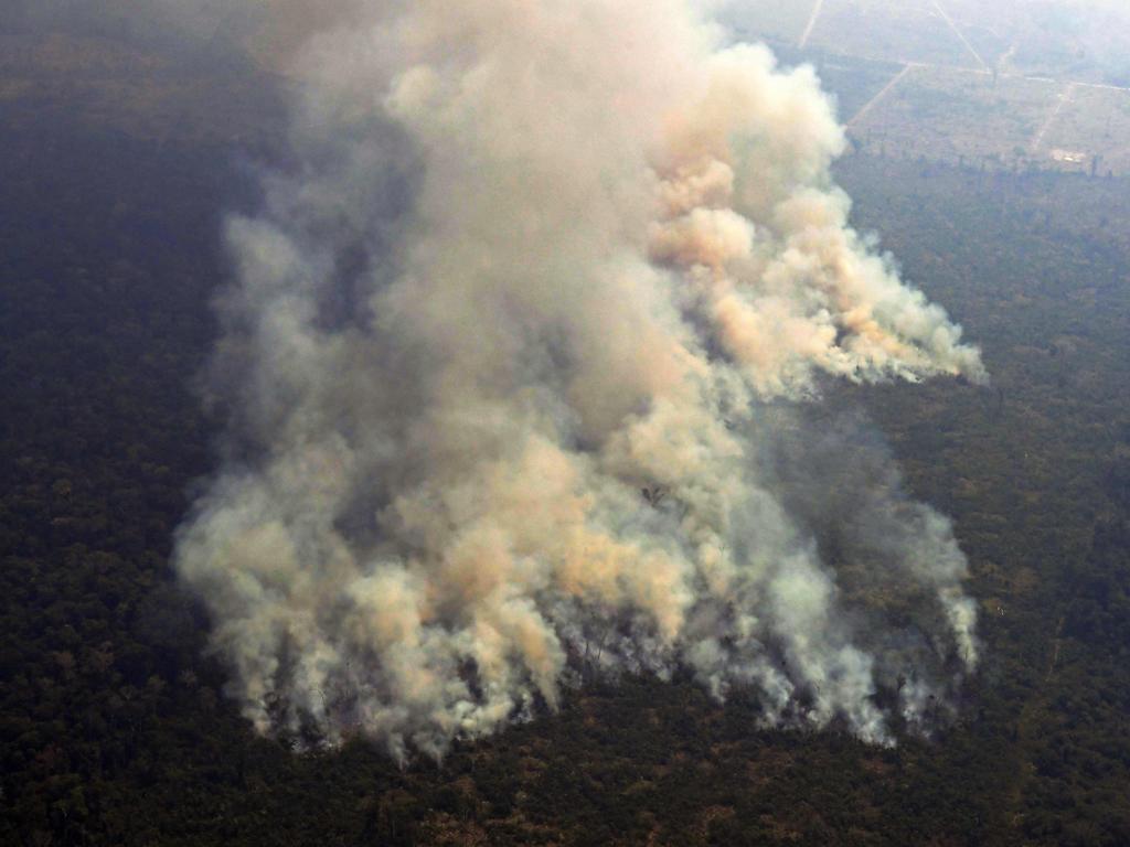 Aerial picture showing smoke from a two kilometre-long stretch of fire billowing from the Amazon rainforest about 65km from Porto Velho, in the state of Rondonia, in northern Brazil. Picture: AFP