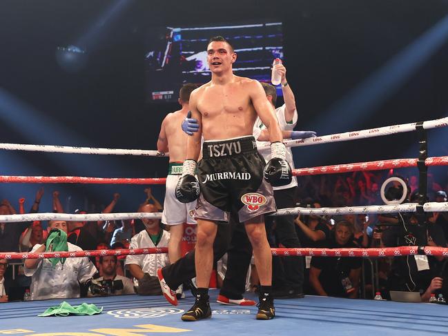 NEWCASTLE, AUSTRALIA - MARCH 31: Tim Tszyu reacts after Dennis Hogan's team throw his towel in the ring during the WBO Global Super Welterweight title fight between Tim Tszyu and Dennis Hogan  at Newcastle Entertainment Centre on March 31, 2021 in Newcastle, Australia. (Photo by Cameron Spencer/Getty Images)