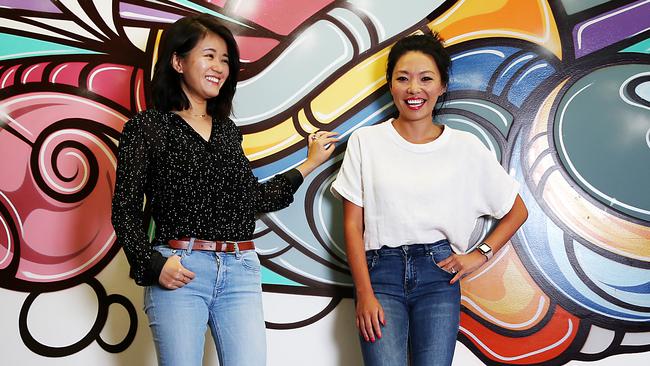 Louise Chen, left, and Lisa Qi, founders of the parking app Oscar, at their new offices in the Sydney CBD on Monday. Picture: Jane Dempster